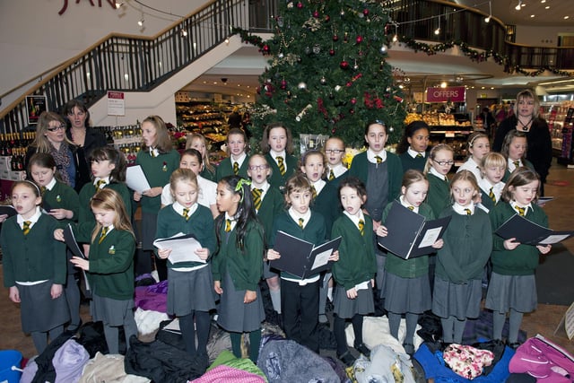 Lytham CofE Primary School carol singings at Booths in 2010