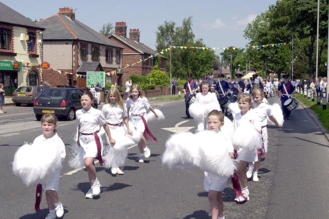 Bilsborrow Festival pom pom dancers and St Peter's Marching Band lead the procession through the village