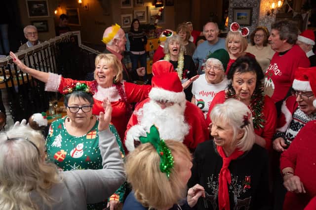 Bev Sykes in great voice as Just Good Friends sing in Christmas outfits at the Victoria Pub in St Annes.