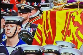Left: Alex Stuart, 19, from Blackpool, was chosen as one of the Navy troops to pull the gun carriage carrying the Queen's coffin during the state funeral on Monday, September 19