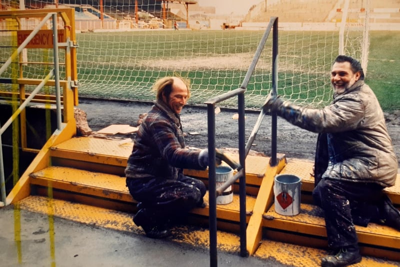 Painters Alan Carthy and Bob Russell putting the finishing touches to new barriers at Bloomfield Road in 1990