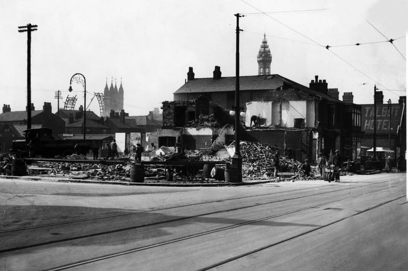Demolishing property in Talbot Road in 1929 to make way for a bigger Corporation bus station. The partly dismantled Big Wheel is in the background. Also in the pic are St John's Church and the Talbot Hotel (on the right)