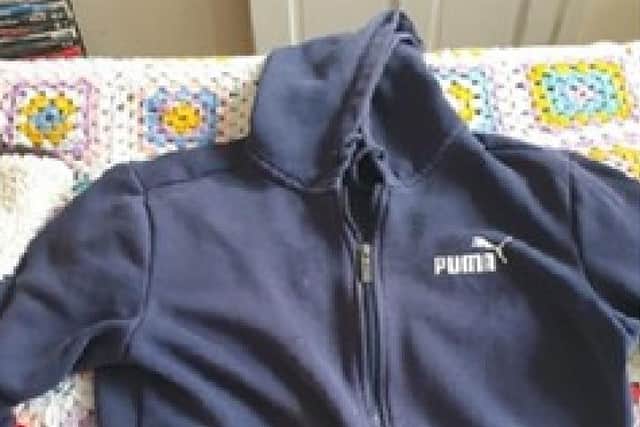 Bruce was last seen wearing a navy blue Puma hoodie, like the one pictured (Credit: Lancashire Police)