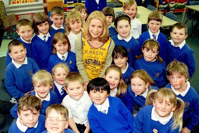 Karen Sylvester, who teaches at Flakefleet School in Fleetwood, took part in the London Marathon, and as part of the fundraising pupils were asked to match old photos of teachers with what they look like now. Pictre shows Karen, wearing a running vest signed by pupils, with her class