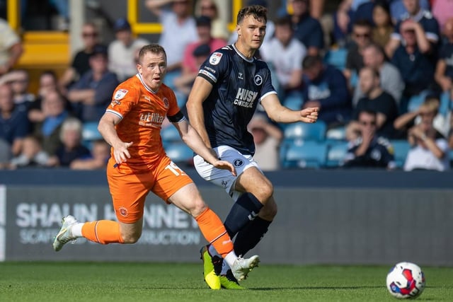 Shayne Lavery battles with Millwall's Jake Cooper