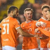 Yates celebrates after giving Blackpool an early lead from the penalty spot
