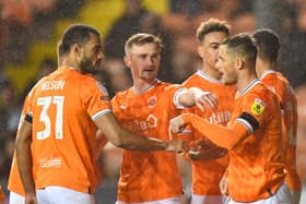 Yates celebrates after giving Blackpool an early lead from the penalty spot