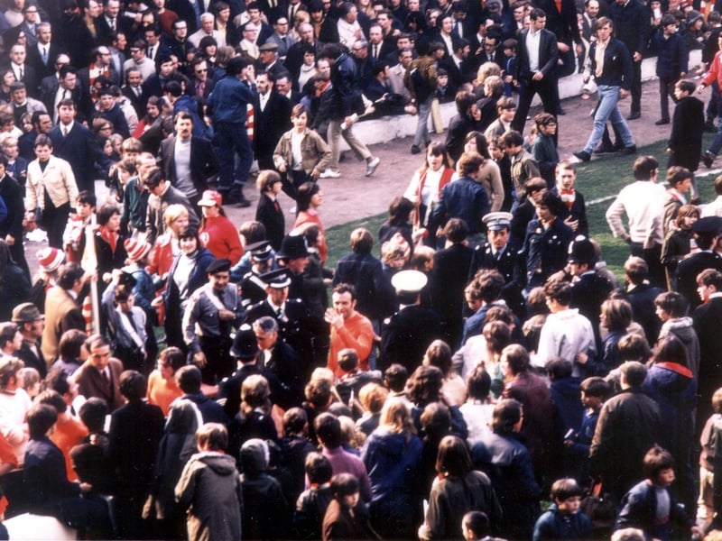 Jimmy Armfield leaving the field at the end of the Manchester United game in 1971. Manager, Bob Stokoe, at the foot of the corner flag