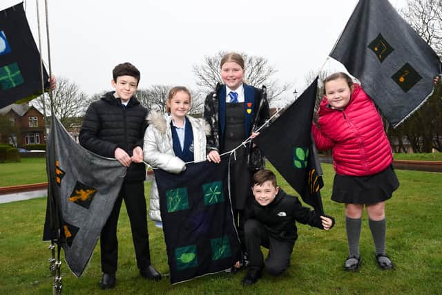 Flag raising art project at The Mount in Fleetwood with pupils from St Mary's Primary and artist Henry Iddon. L-R are Caleb Rifai, Liana Stoney, Gracie Ward, Eden Webster and Florence Martinez.