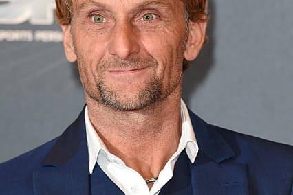 Carl George Fogarty, 58, MBE, often known as Foggy, is an English former motorcycle racer and one of the most successful World Superbike racers of all time. He also holds the second highest number of race wins at 59. He is the son of former motorcycle racer George Fogarty. He retired in 2000. He won the 14th series of ITV's I'm a Celeb.