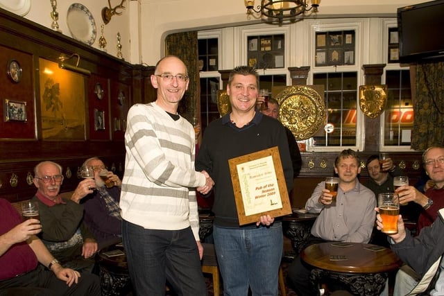 Blackpool, Fylde and Wyre CAMRA branch chairman Ian Ward presents the Pub of the Season award to Ramsden Arms landlord Brian Luxton, 2009