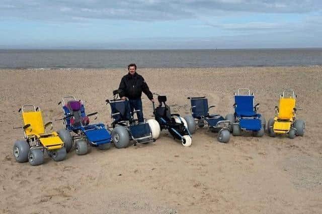 Mick Gray with some of the beach wheelchairs