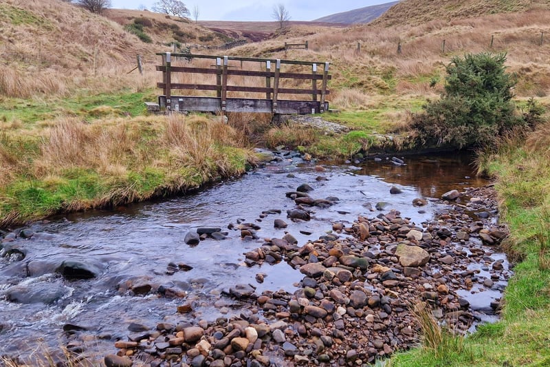 A wooden bridge over a meandering stream not far from Scorton