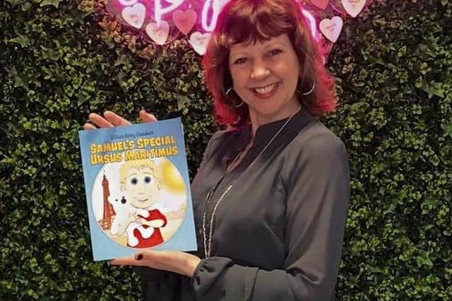 Gillian happily presents her first published children's book.