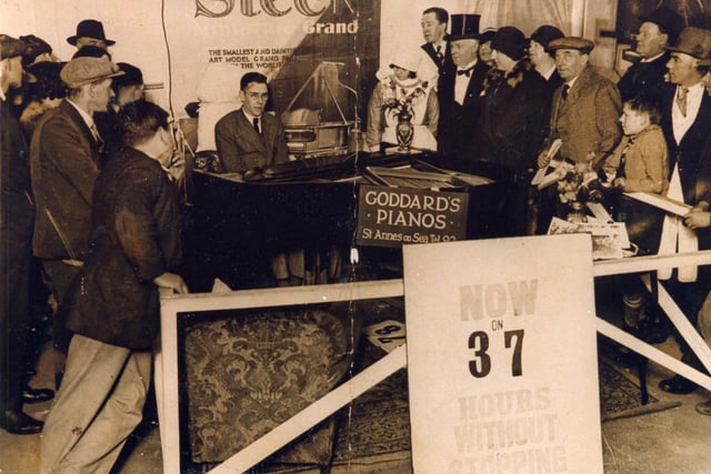 Marathon piano-playing stunt at Lunar Park, Golden Mile, Blackpool in the 1920s. The sign says that 37 hours had been completed and there was a nurse on hand in case the pianist collapsed.