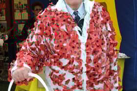 Spencer Leader in a poppy suit he donned several years ago to collect for the Poppy Appeal