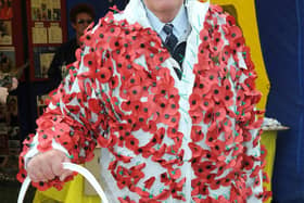 Spencer Leader in a poppy suit he donned several years ago to collect for the Poppy Appeal