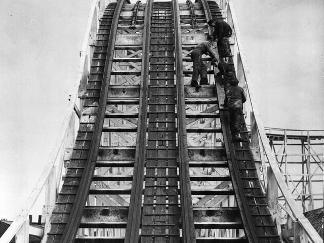 Workmen preparing a stretch of the Big Dipper, called Becher's Brook, for the start of the holiday season at Blackpool Pleasure Beach