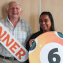 Bob Woof, an 82-year-old blind veteran from Carnforth, celebrates winning £25,000