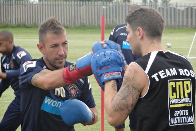 Boxer Brian Rose training with Blackpool FC midfielder Angel Martinez