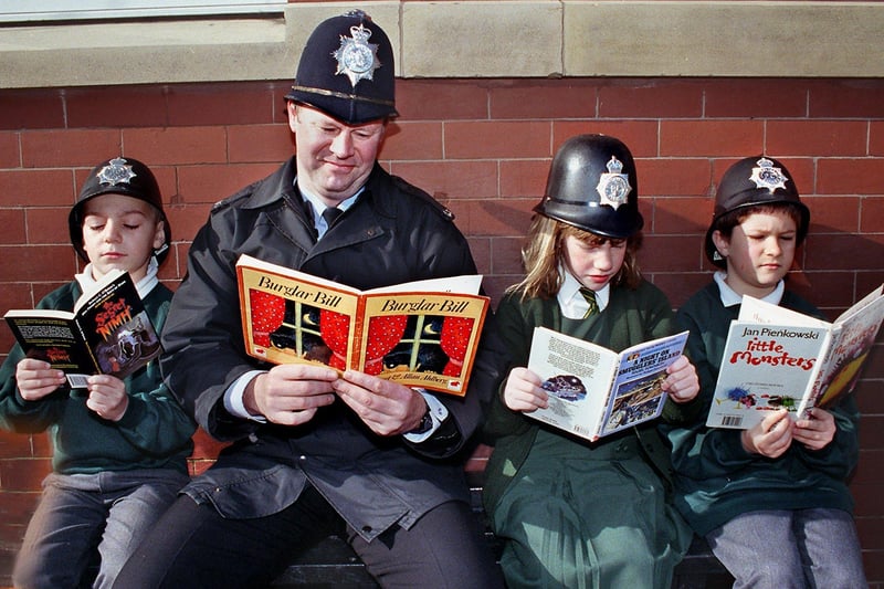 PC Alan Jubb reading with (from left), James Neale, Lucia Pasqualino and Andrew Worthington, at St. Kentigern's RC Primary School
