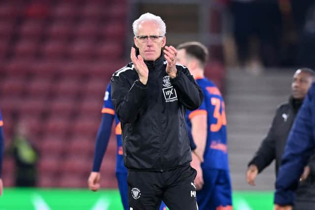 Blackpool's English head coach Mick McCarthy applauds the fans on the pitch after the English FA Cup fourth round football match between Southampton and Blackpool at St Mary's Stadium in Southampton, southern England on January 28, 2023. - Southampton won the game 2-1.