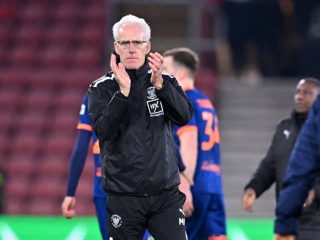 Blackpool's English head coach Mick McCarthy applauds the fans on the pitch after the English FA Cup fourth round football match between Southampton and Blackpool at St Mary's Stadium in Southampton, southern England on January 28, 2023. - Southampton won the game 2-1.