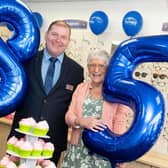 (L-R) Scrivens Poulton branch manager Paul Skelton celebrates the company's 85th anniversary with customer Ann Molloy who also celebrates her 85th birthday
