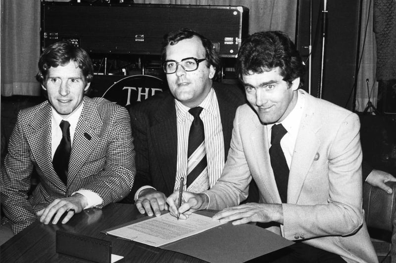 A happy chairman of Blackpool Football Club Mr Peter Lawson with new 1980 season signings Alan Bell (left) and Ted Macdougall at the Tangerine Club