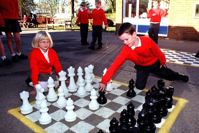 Thomas Handiforth and  Sarah Marsden enjoy a game of playground chess at St John's School in Poulton in 1999