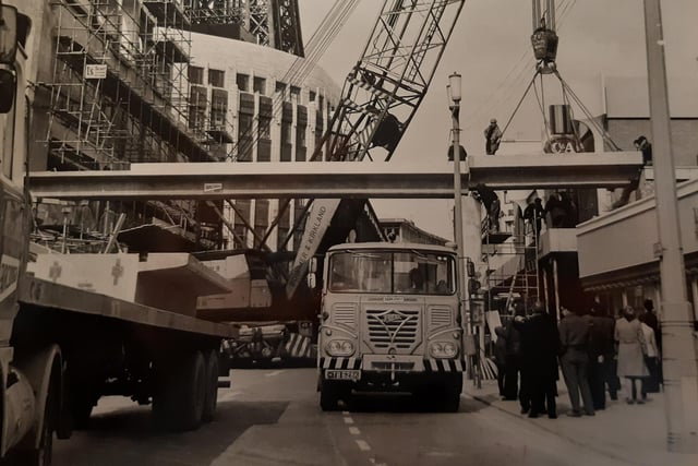Huge girders are lifted in place as the bridge takes shape across Bank Hey Street