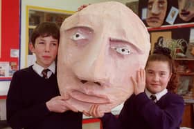 Matthew Johnstone and Charlene Pelzer, both 13, with a giant mask in 1997