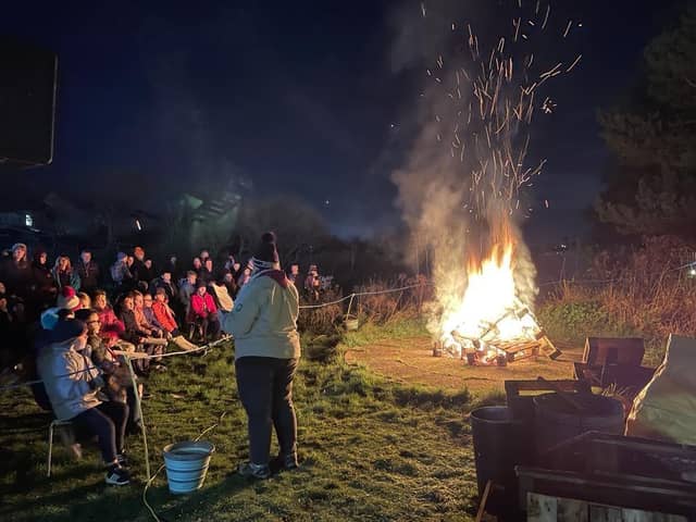 Blackpool Scouts singing around the campfire.