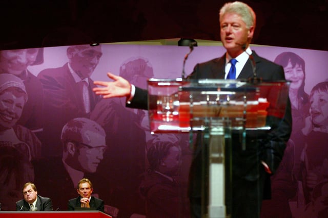 Deputy Leader John Prescott and British Prime Minister Tony Blair listen to former US President Bill Clinton address the Labour Party's annual conference October 2, 2002