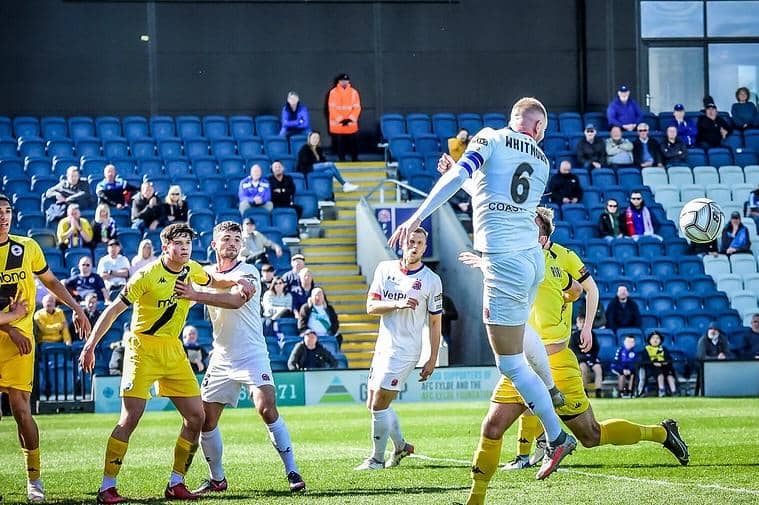 Alex Whitmore heads clear for Fylde against Chester  Picture: STEVE McLELLAN