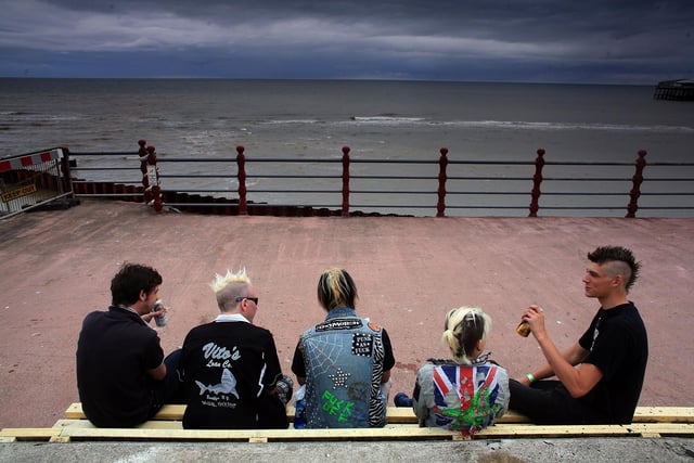 Blackpool traditionally hosts a multitude of entertaining events, from gigs and concerts to air shows and festivals. This picture shows Punk rockers sat on a bench on Blackpool beach before the start of the Rebellion Festival on  August 10, 2007