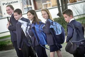Pupils at Palatine School in Blackpool arrive at school with heavy bags to illustrate how children were damaging their backs by taking too much to school. Pic L-R: Alex Judge, Kayne Dickinson, Rebecca Holland, Shannen Cooper and Sam Valentine