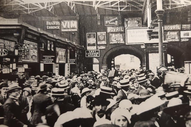 Crowds await departure from Central Station - probably 1920s. Check out the advertising boards for Bovril and Vim