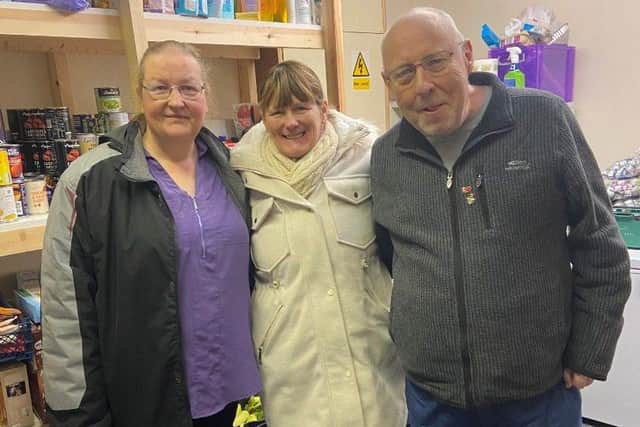 Maureen Baxter, Carol Thomas and John Wynn at the food hub.