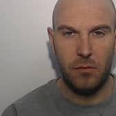 David Handley is wanted for stalking, controlling and coercive behaviour and assault (Credit: Greater Manchester Police)