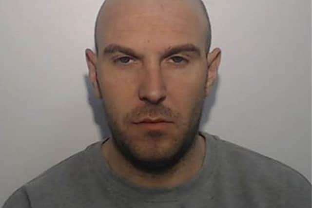 David Handley is wanted for stalking, controlling and coercive behaviour and assault (Credit: Greater Manchester Police)