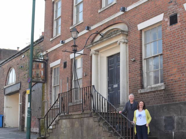 Coun Liz Oades and Coun Karen Buckley outside the former Hillside Restaurant premises in Preston Street, Kirkham