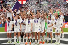 England's Ellen White and Jill Scott lift the trophy as England celebrate winning the UEFA Women's Euro 2022 final at Wembley Stadium, London. Picture date: Sunday July 31, 2022.
