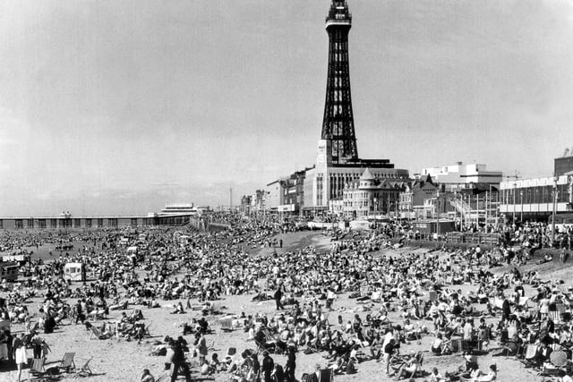 You can barely put a pin between people in this scene of Blackpool beach, 1988