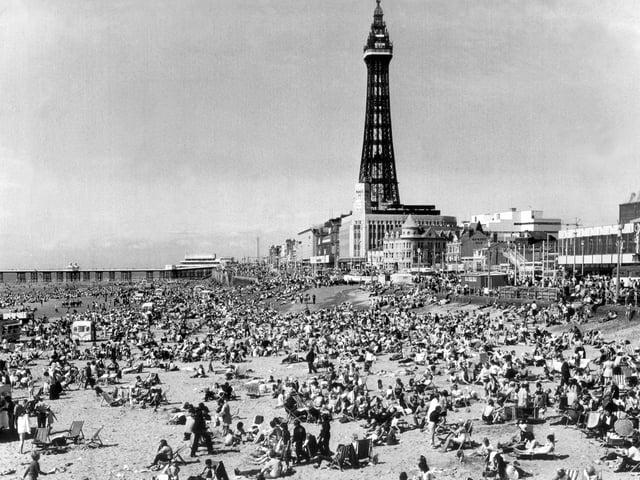 You can barely put a pin between people in this scene of Blackpool beach, 1988