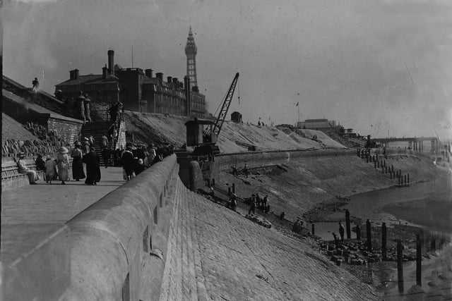 Construction of the seawall and promenade north of North Pier, with the Metropole Hotel on the left