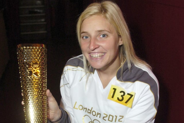 Paralympian Shelly Woods with the torch she carried through the streets of her home town