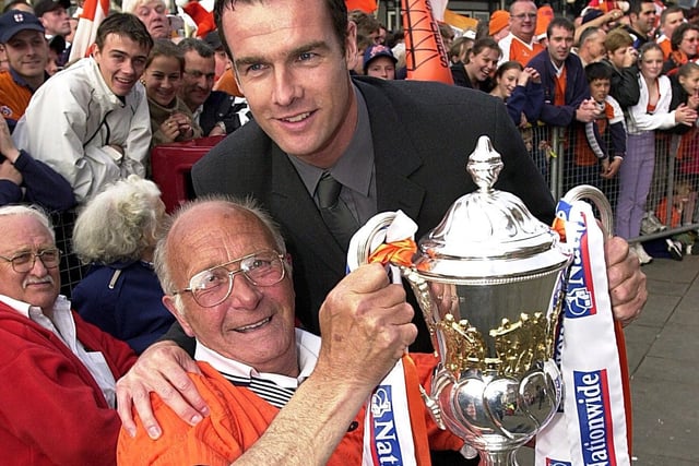 Match Skipper Brian Reid with lifelong fan Dave Burns at the victory reception in 2001