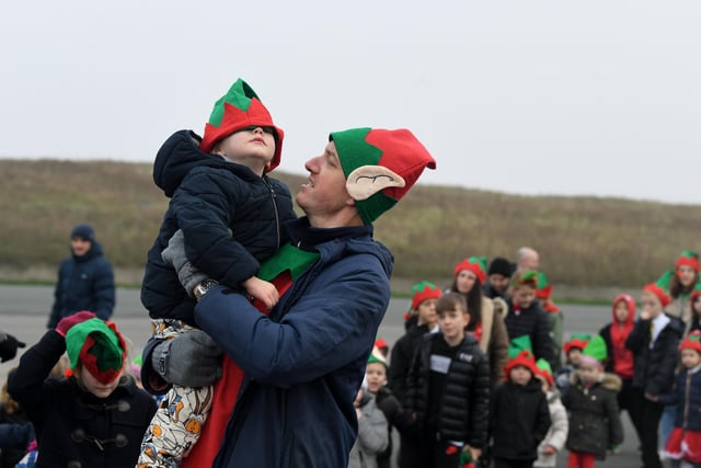 This little elf gets a bit of a lift during the latest Elf Run at Chaucer Primary  School, Fleetwood Photo: Neil Cross