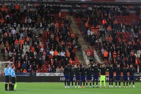 Blackpool players and fans honour The Queen with a minute's silence at Rotherham